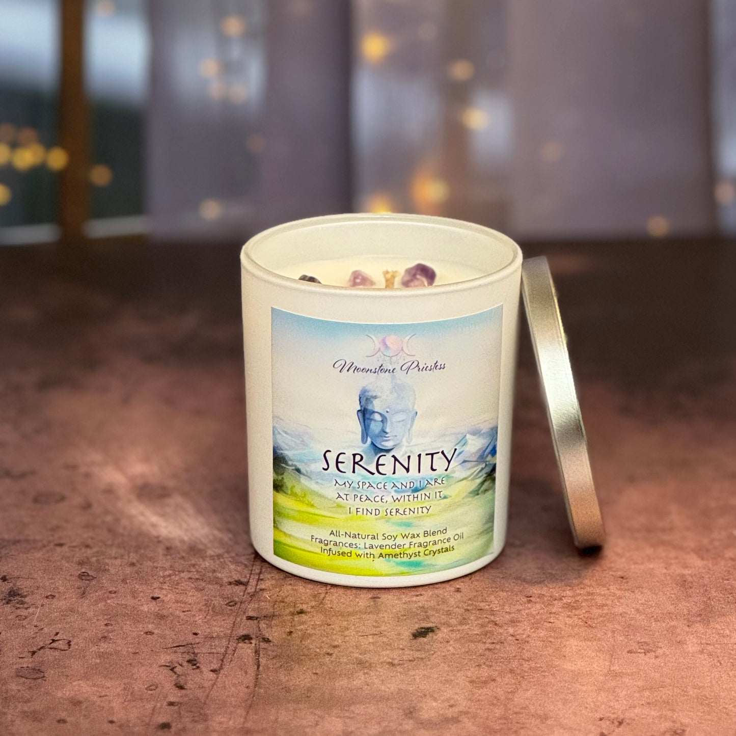 Serenity candle with a label on a wooden surface