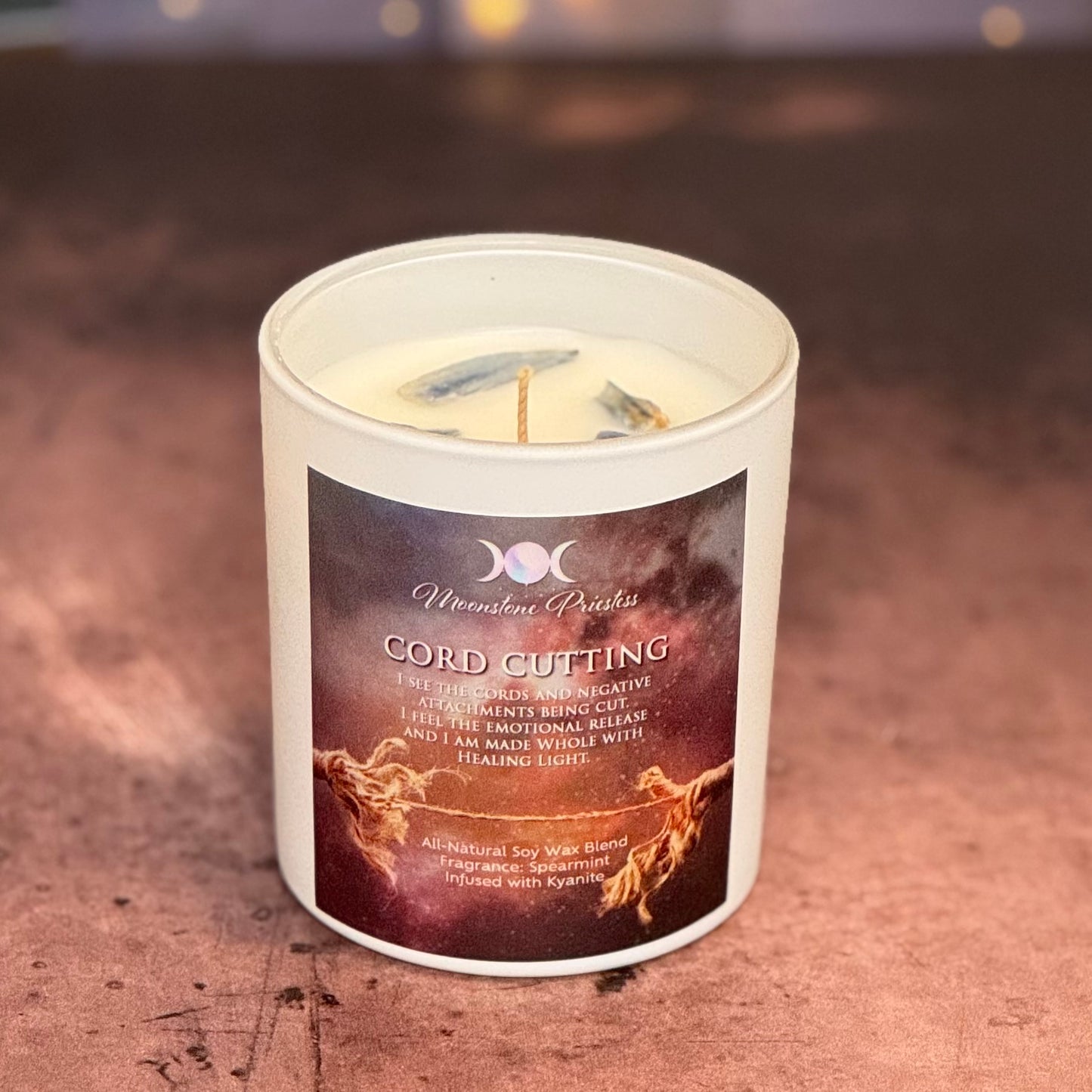 Candle with a label on a textured surface