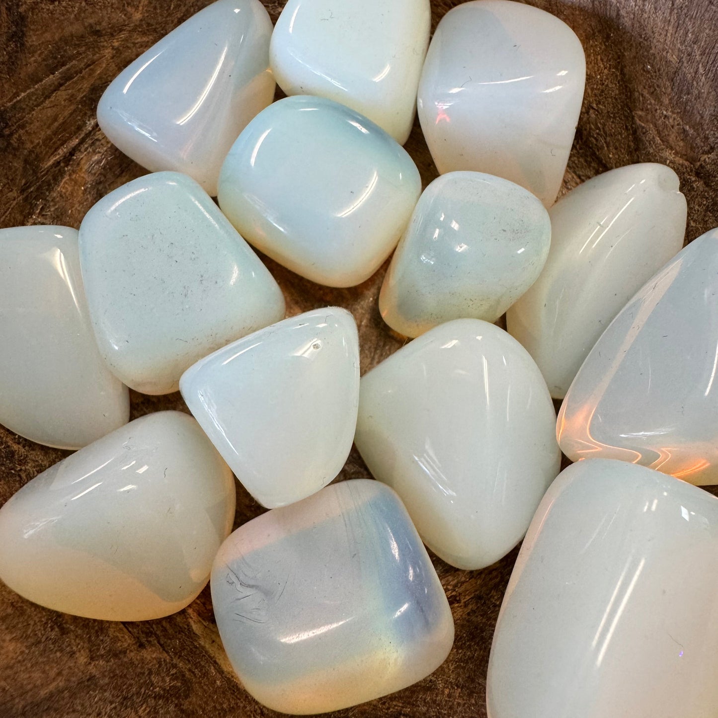 opalite stones on a wooden surface