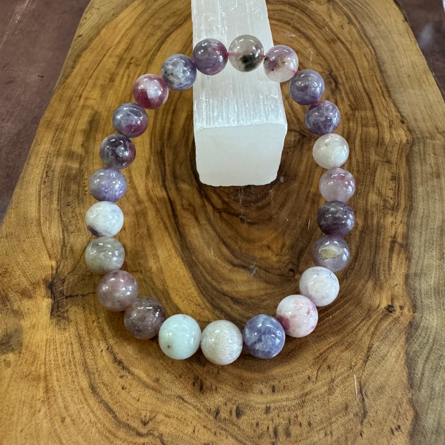 Multicolored beaded bracelet on a wooden surface
