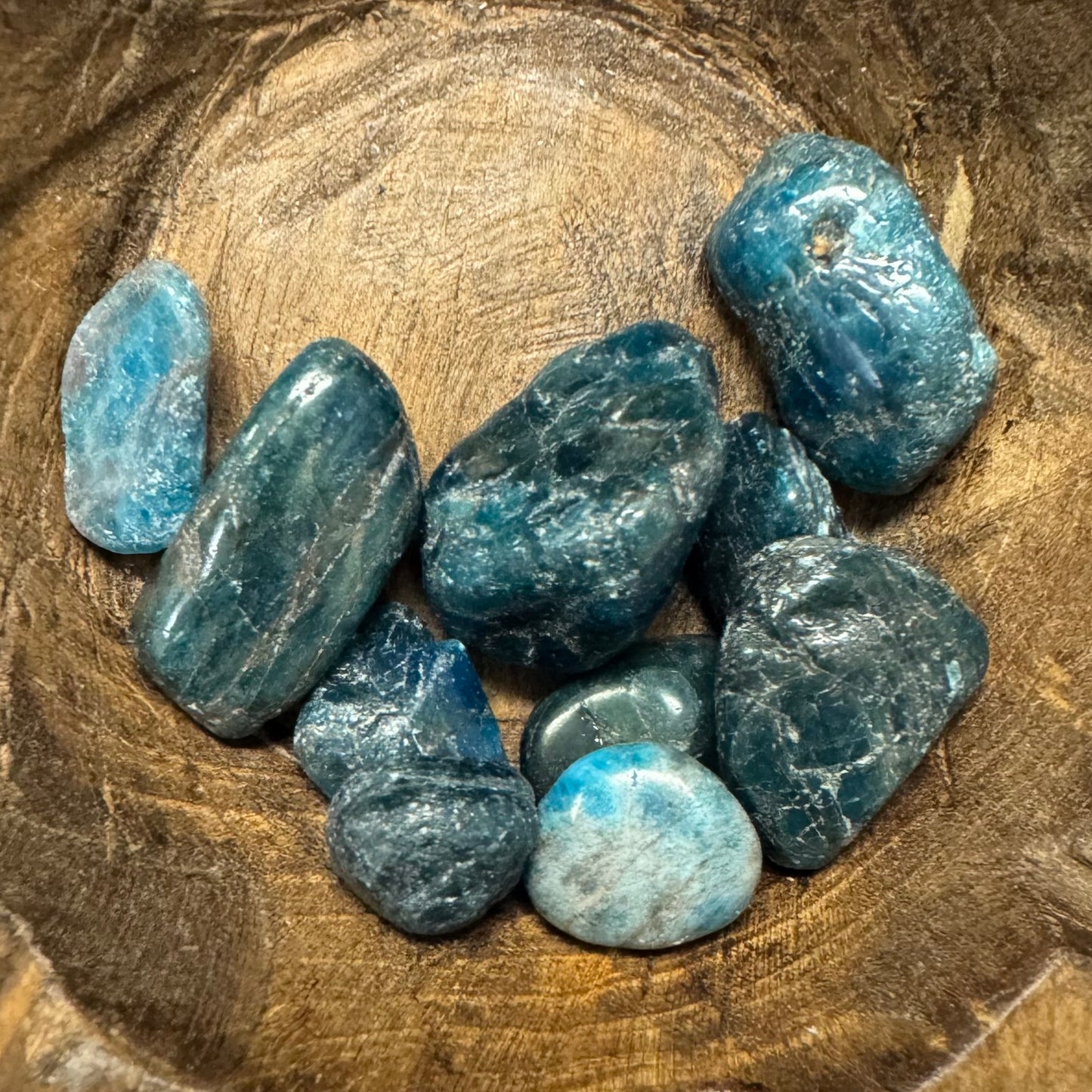 Blue stones on a wooden surface