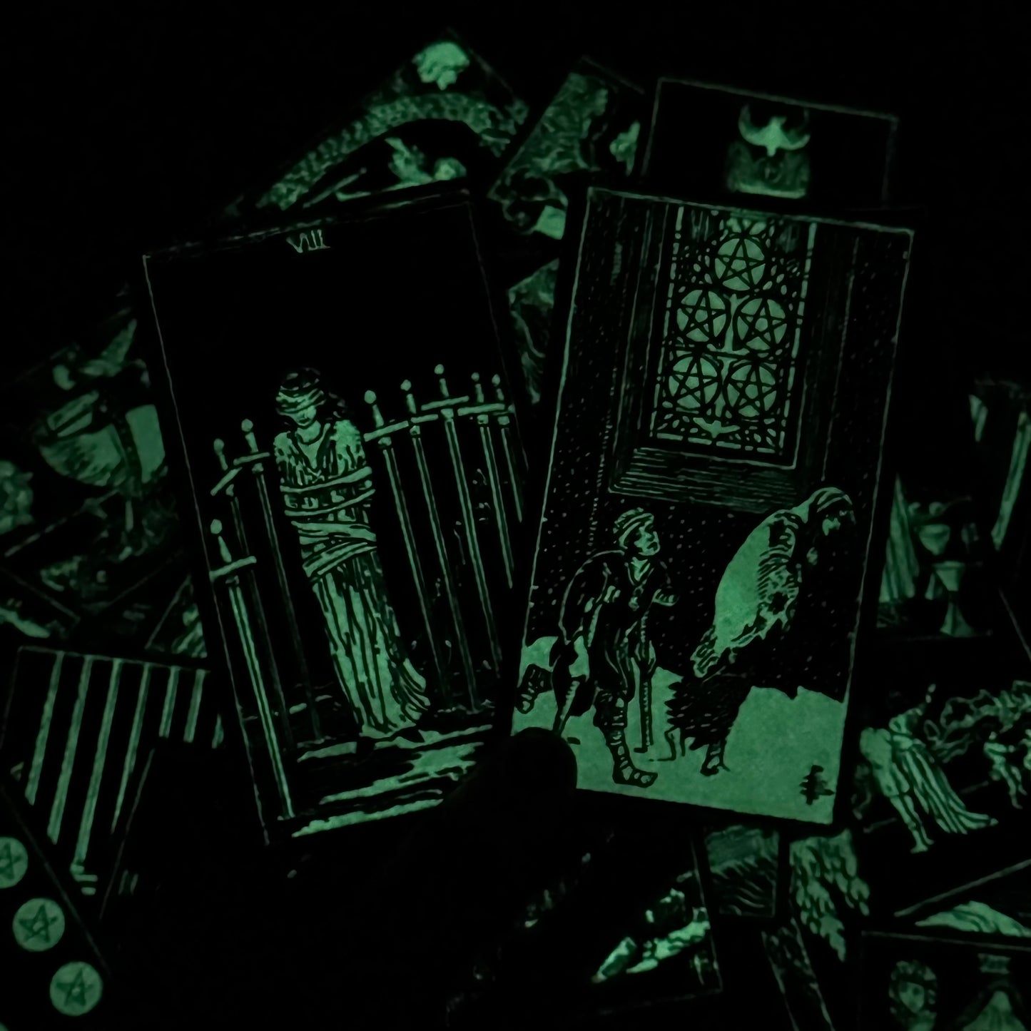 Glowing tarot cards with dark background