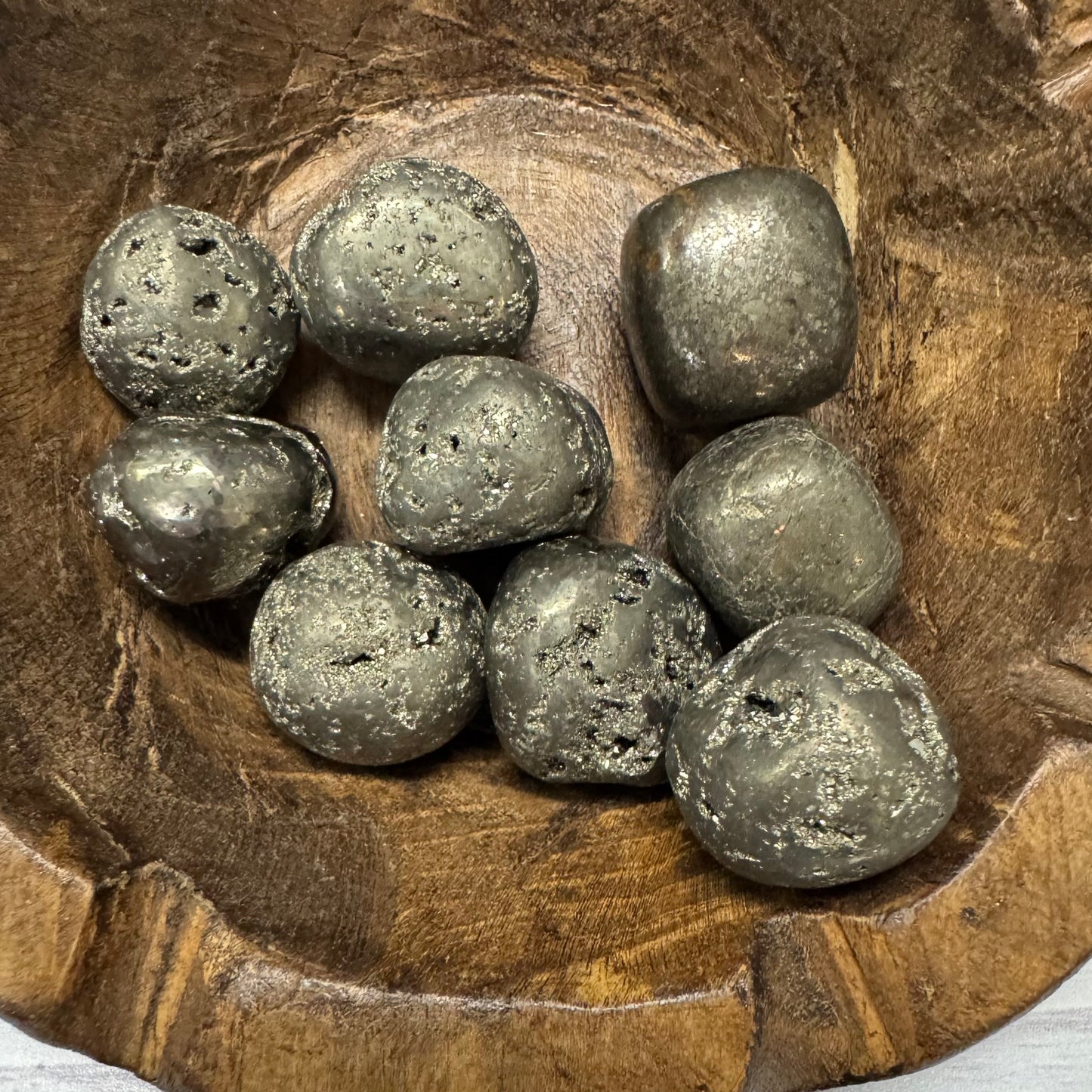 Gray stones on a wooden surface