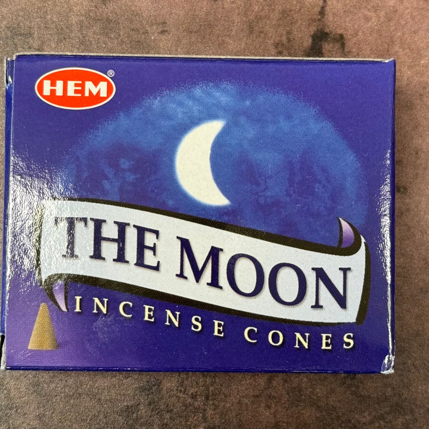 A box of 'The Moon' incense cones by HEM with a crescent moon design on the packaging.