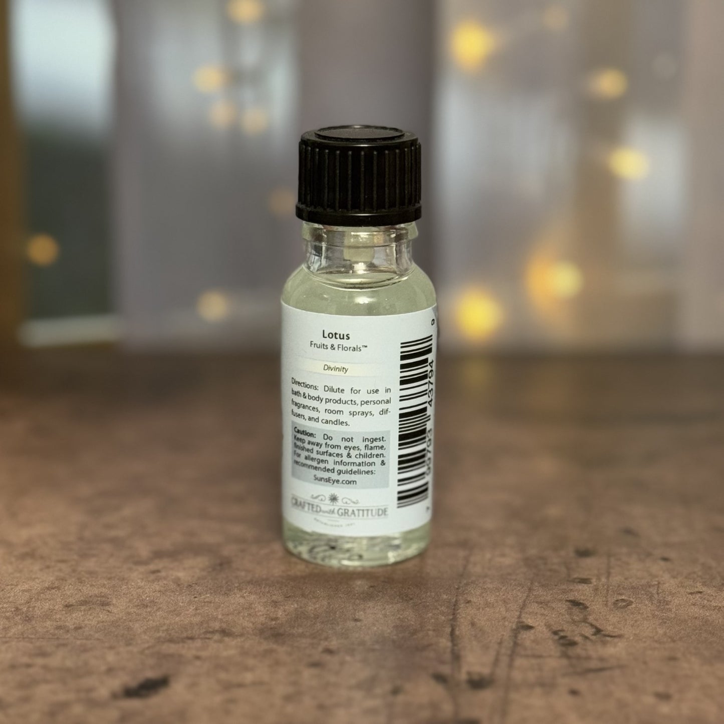 Small bottle with a label on a wooden surface