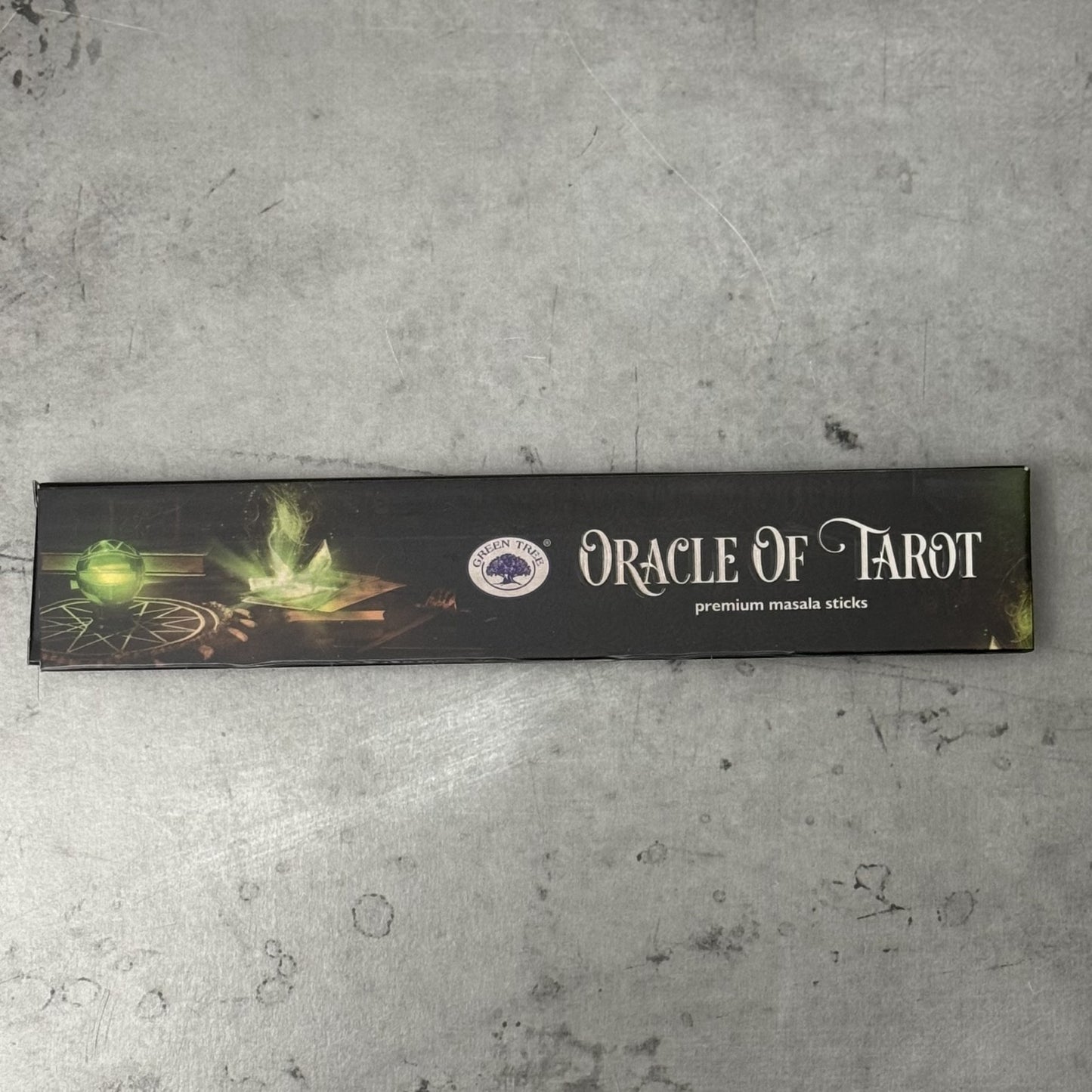 Box of Oracle of Tarot Green Tree premium masala sticks on a gray surface