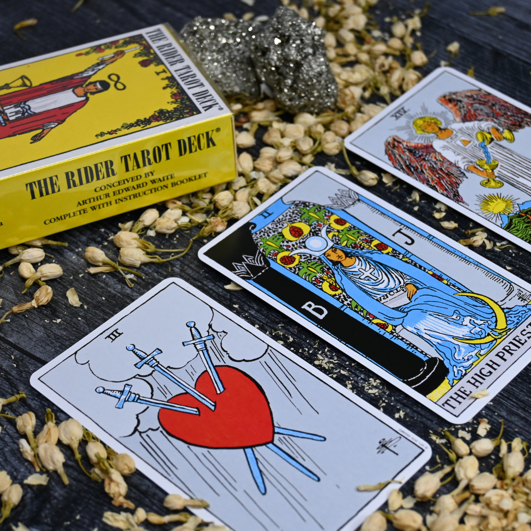 Rider waite cards three of swords high priestess