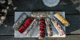 sage bundle burning in a sacred space for energy clearing and spiritual protection