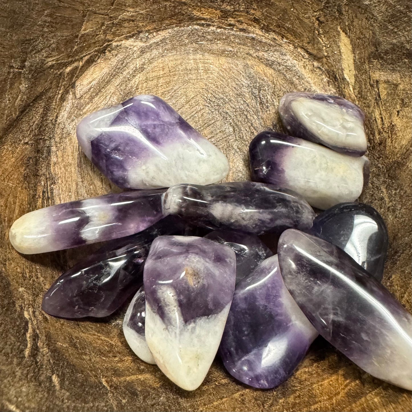 Amethyst crystals on a wooden surface