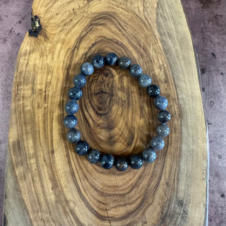 Blue beaded bracelet on a wooden surface