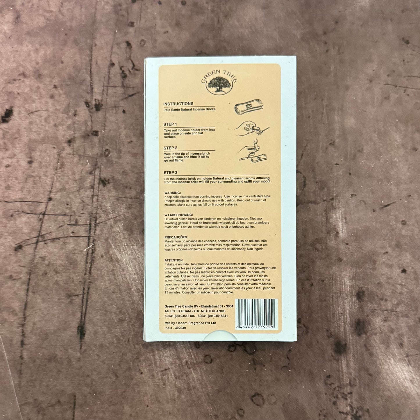 Product label with text and a barcode on a textured surface