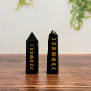 Polished Black Obsidian crystal tower with moon phase etchings on glossy black stone