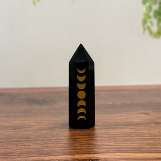 Black Obsidian obelisk tower etched with the phases of the moon