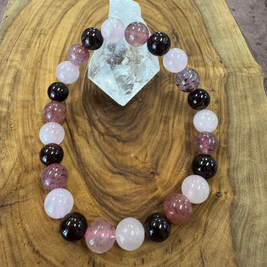 Gemstone bracelet with multicolored beads on a wooden surface