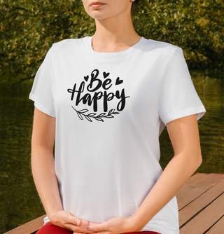 Ash Be Happy t-shirt with hand-lettered script, hearts, and a leaf design, worn outdoors