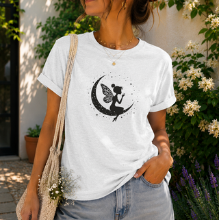 Ash Fairy on Crescent Moon t-shirt with a black fairy and stars design, worn outdoors