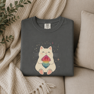 Folded Pepper dark gray Crystal Cat tee with a cute cat holding a rainbow gem on a beige couch