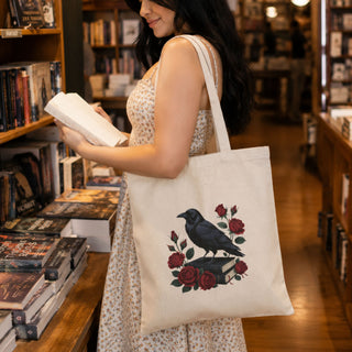 Natural canvas tote with vintage raven perched on books and red roses design