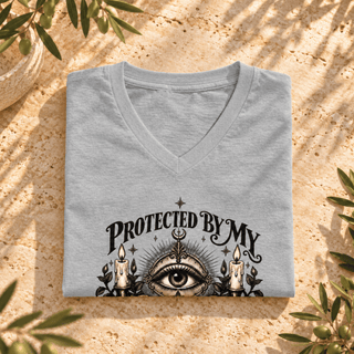 Protected by My Ancestors all-seeing eye and botanical design on a V-neck tee