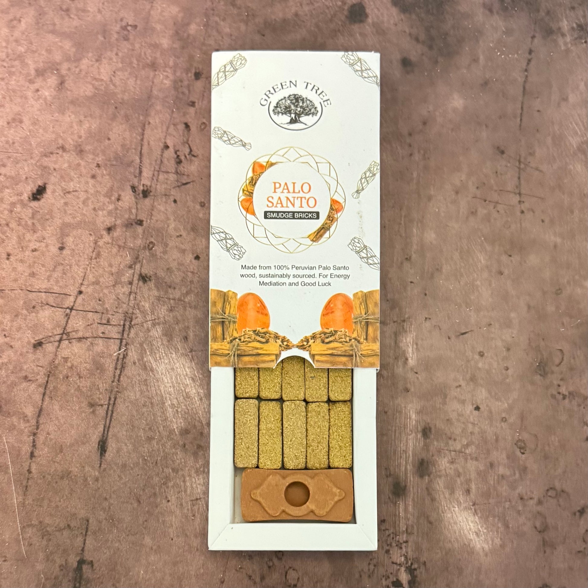 Palo Santo incense sticks packaging on a textured surface