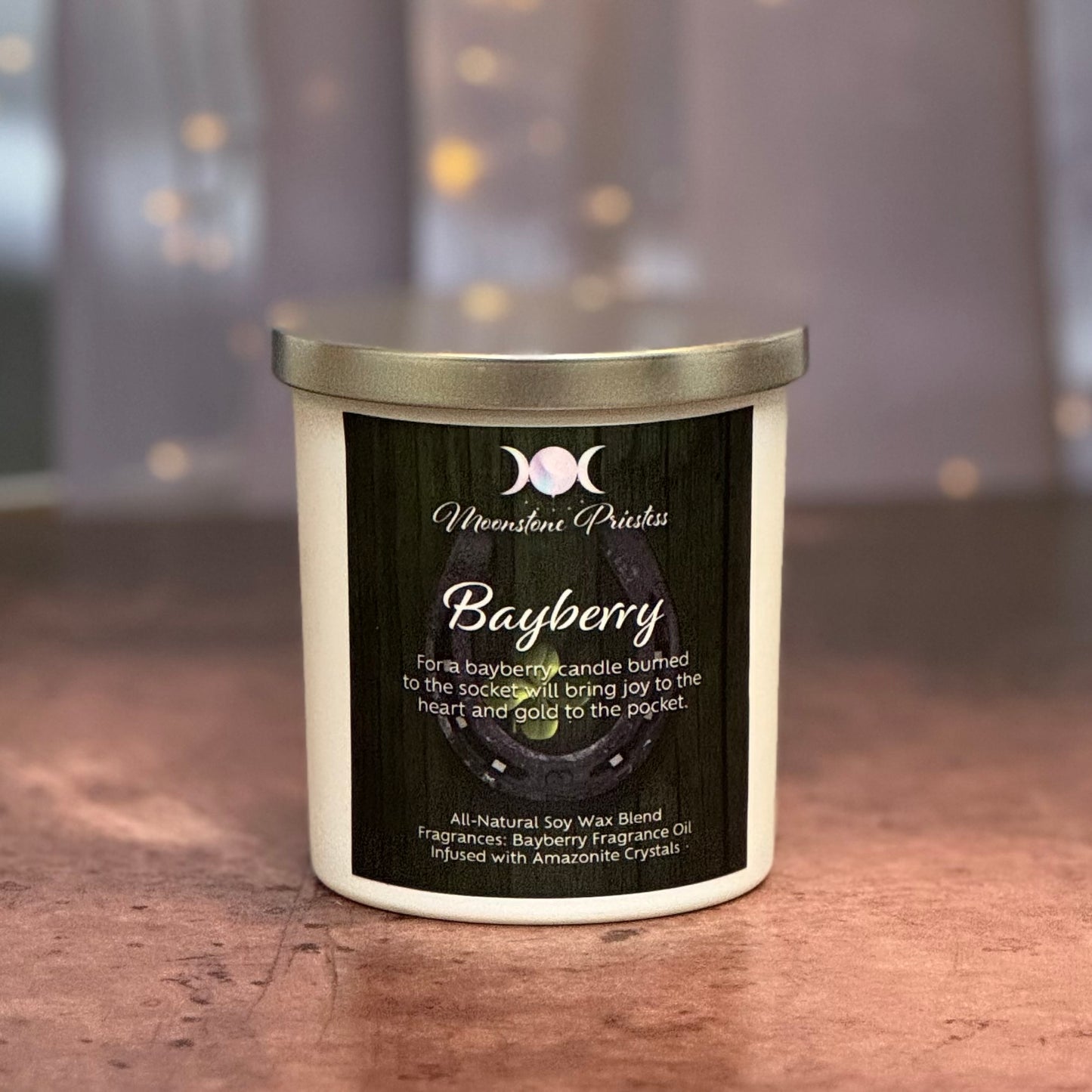 Bayberry candle with a label on a wooden surface