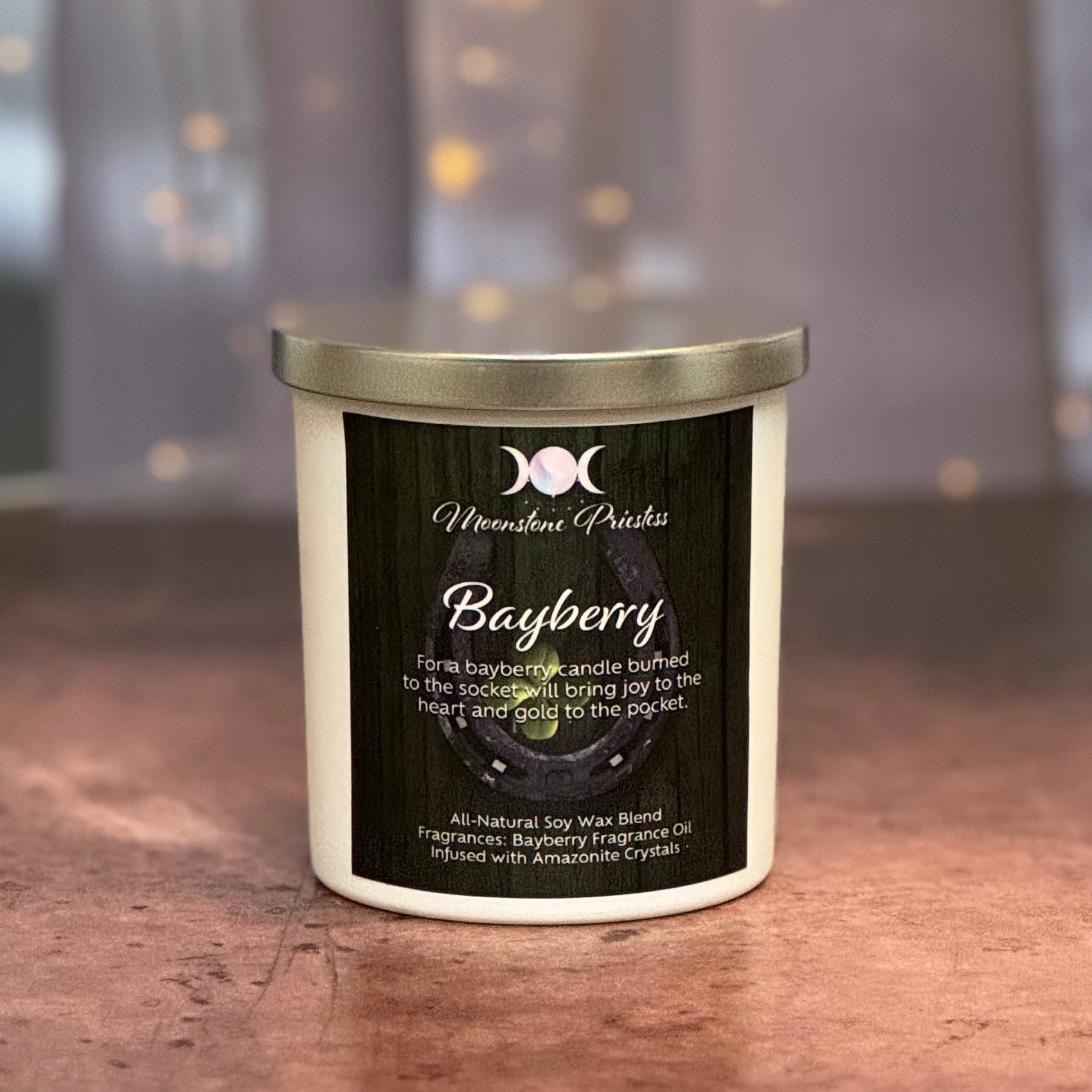 Bayberry candle with a label on a wooden surface