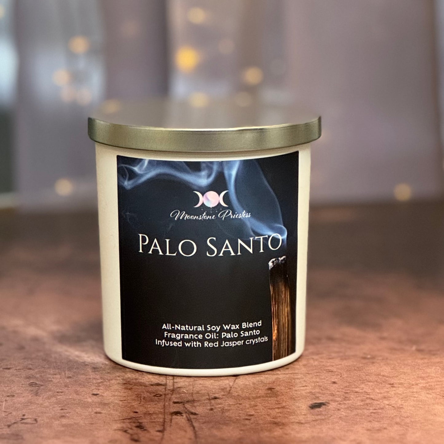 Palo Santo candle with label on a wooden surface