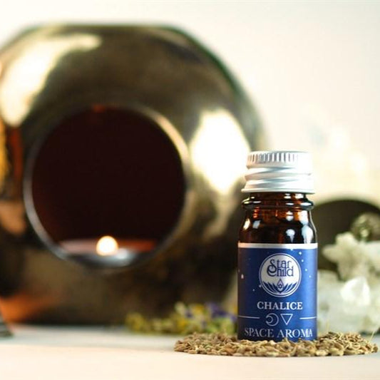 Bottle of 'Chalice' space aroma with decorative items in the background