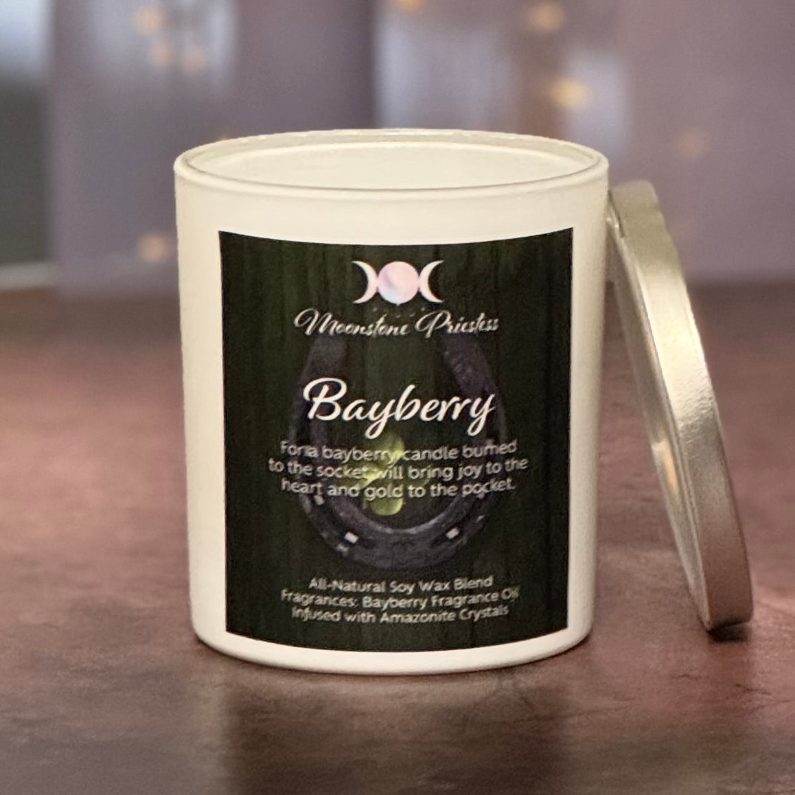 Candle with a label on a dark surface