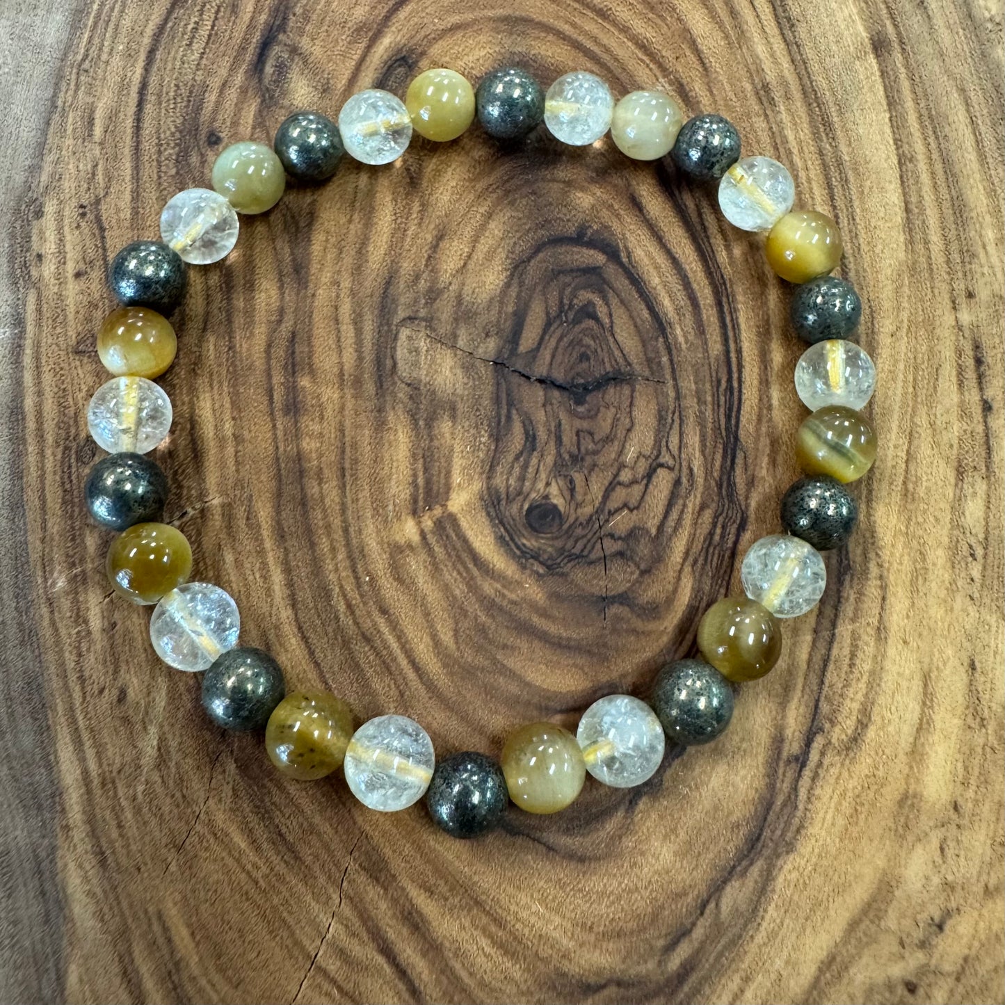 Beaded bracelet with multicolored beads on a wooden surface
