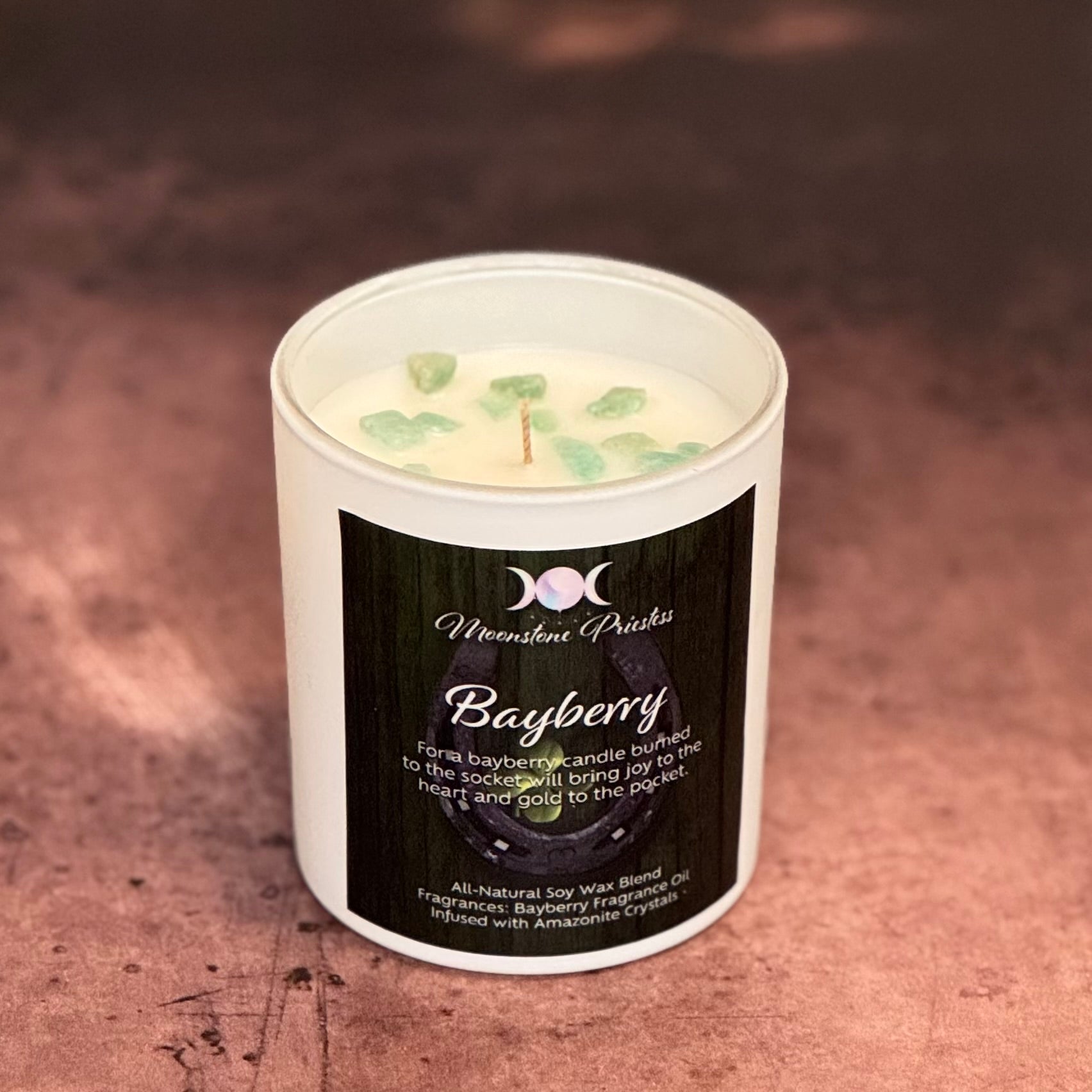 Bayberry candle with a label on a textured surface