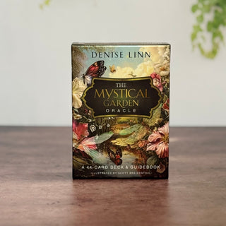 Box for 'The Mystical Garden Oracle' by Denise Linn on a wooden surface with a blurred background