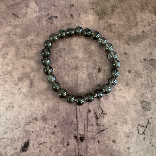 Beaded bracelet on a textured surface