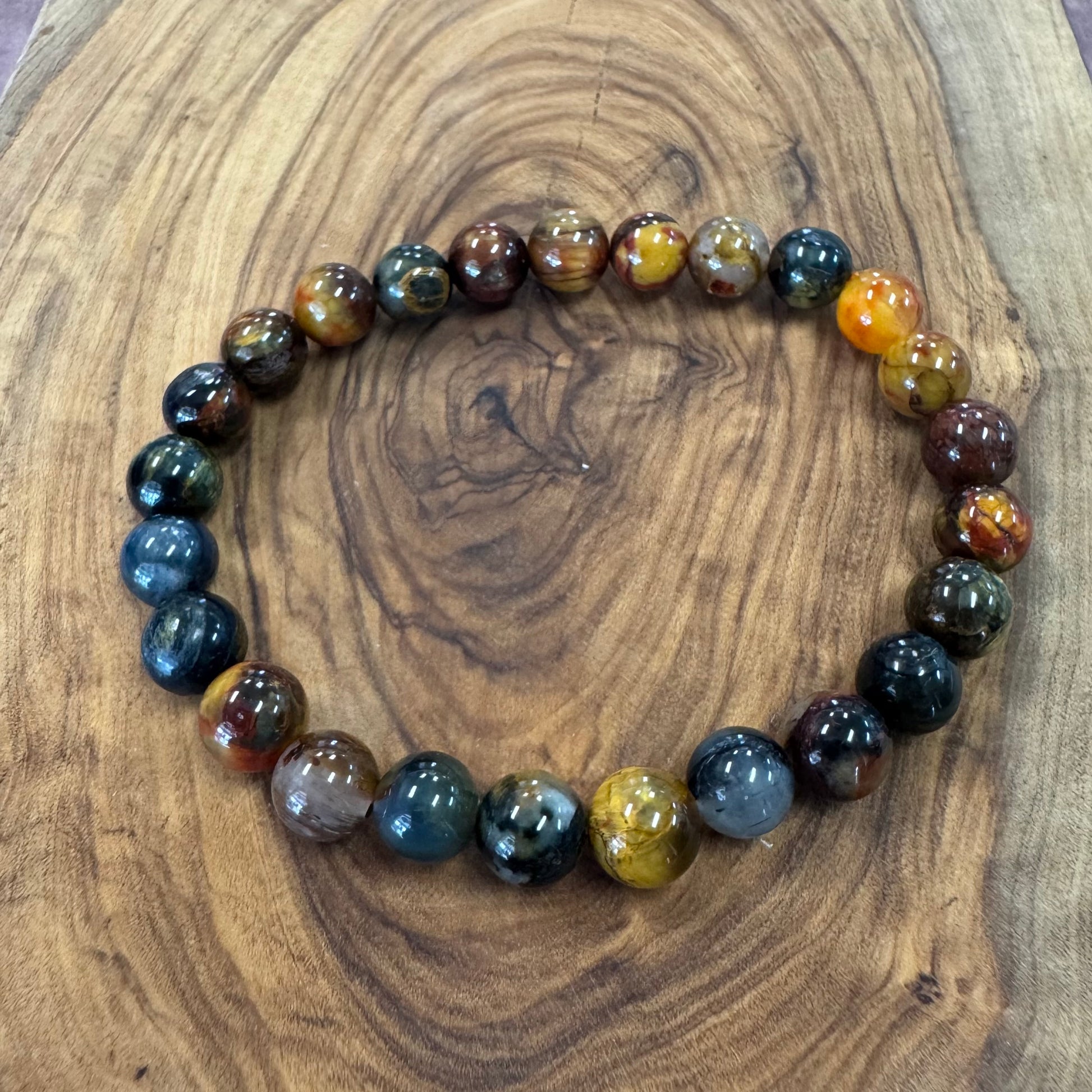 Multicolored beaded bracelet on a wooden surface