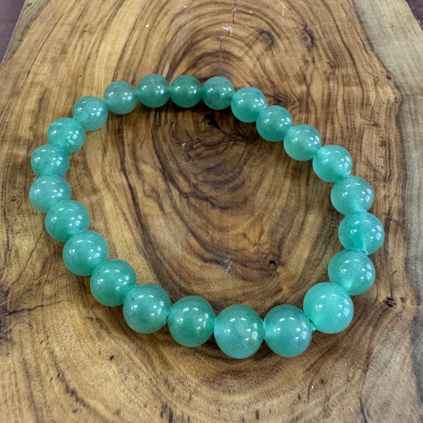 Turquoise beaded bracelet on a wooden surface