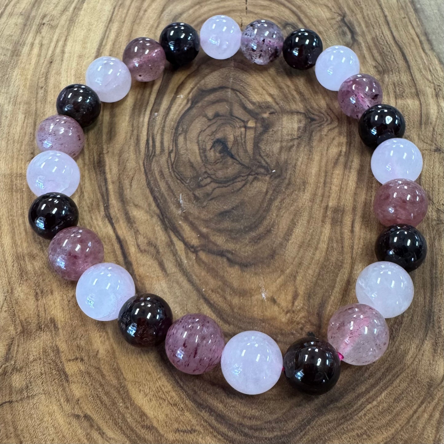 Beaded bracelet with multicolored beads on a wooden surface