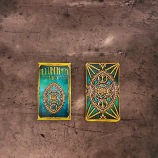 A tarot deck shown from both sides: the front card on the left reads 'ILLUMINATI Tarot' with a teal and gold eye design, and the back on the right features an ornate gold geometric pattern over teal. The cards are placed on a textured brown surface.