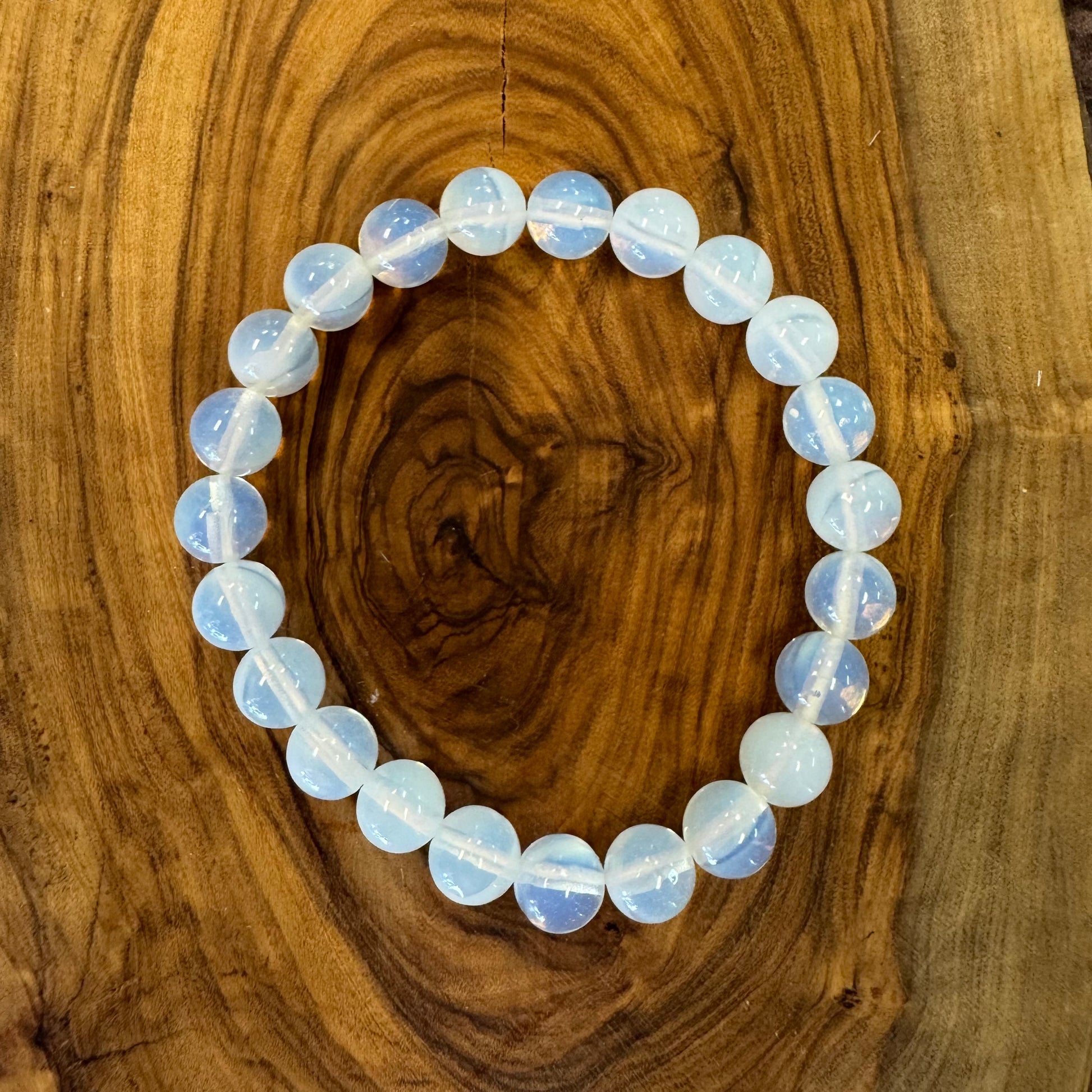Opalite Beaded bracelet on a wooden surface