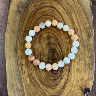 Beaded bracelet with multicolored beads on a wooden surface