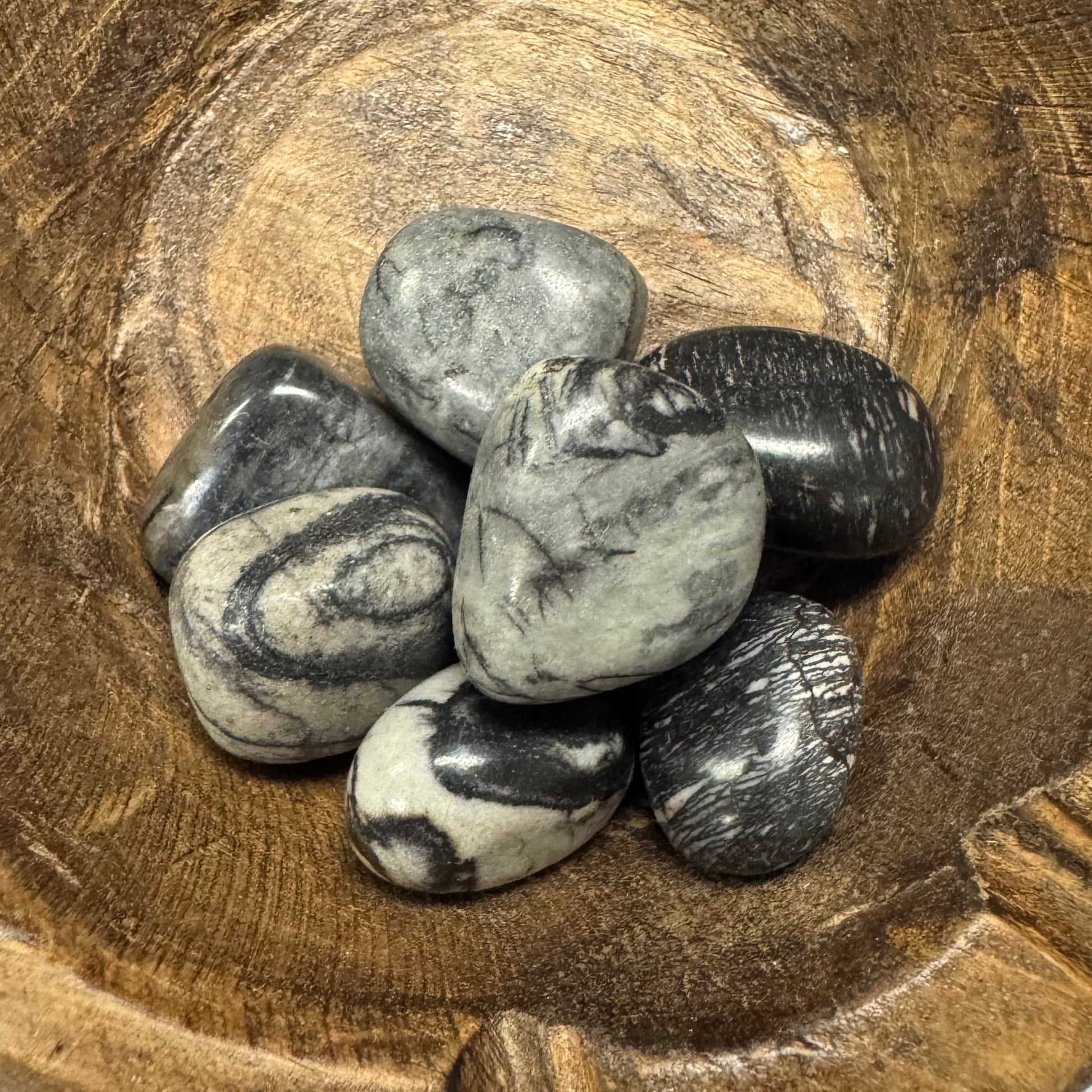 Marbled stones on a wooden surface