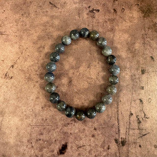 Beaded bracelet on a textured brown surface