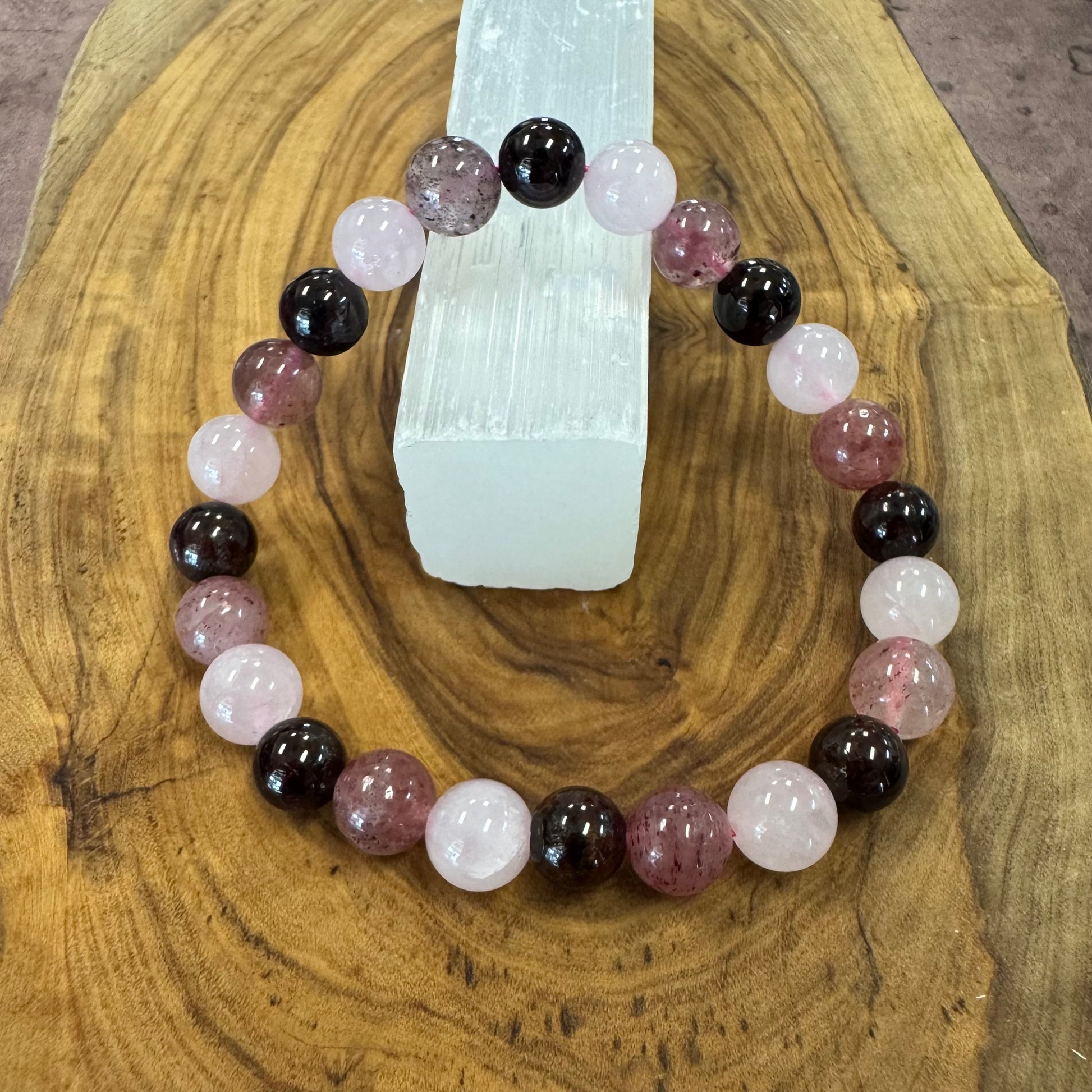 Gemstone bracelet with multicolored beads on a wooden surface