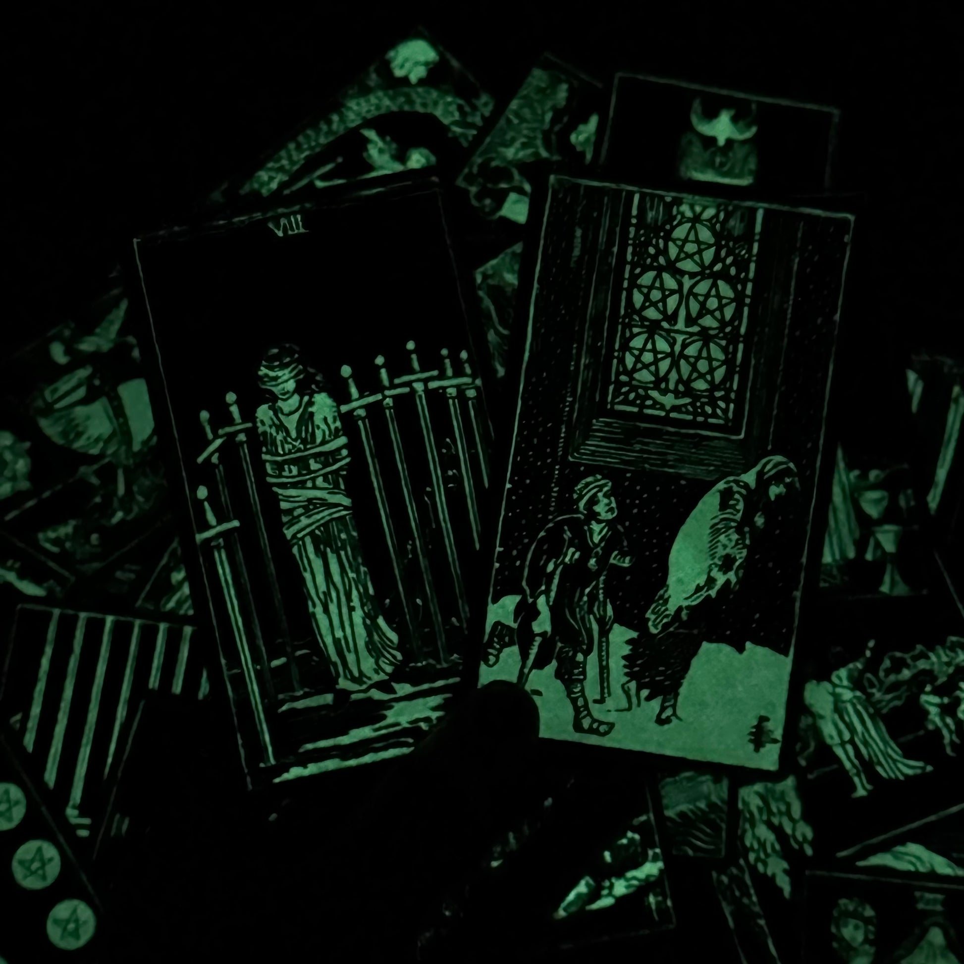 Glowing tarot cards with dark background