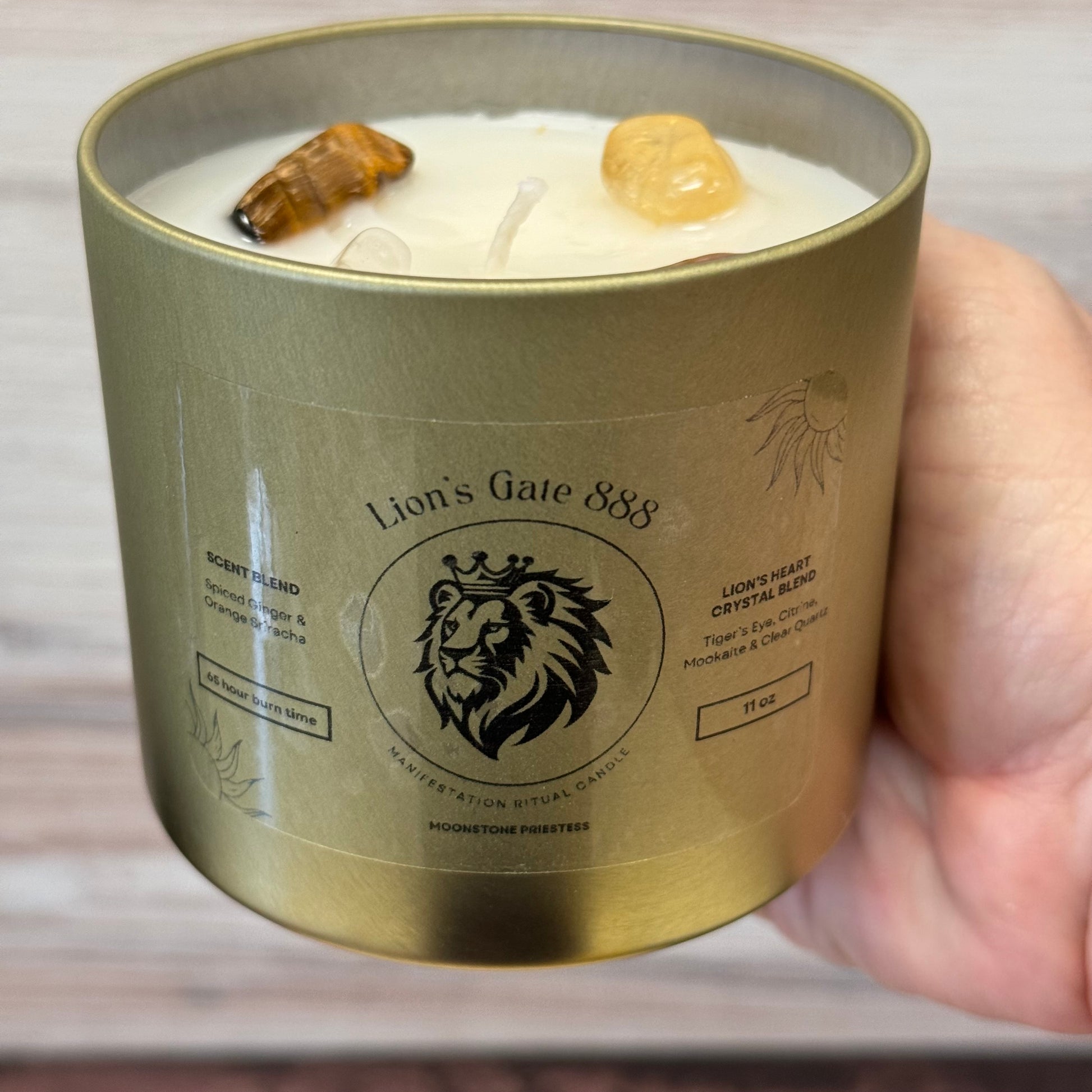 Lion's Gate candle in hand