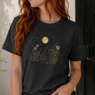Dark Grey Heather Moonlit Cat tee with a gold cat among wildflowers under a full moon, shown on a model