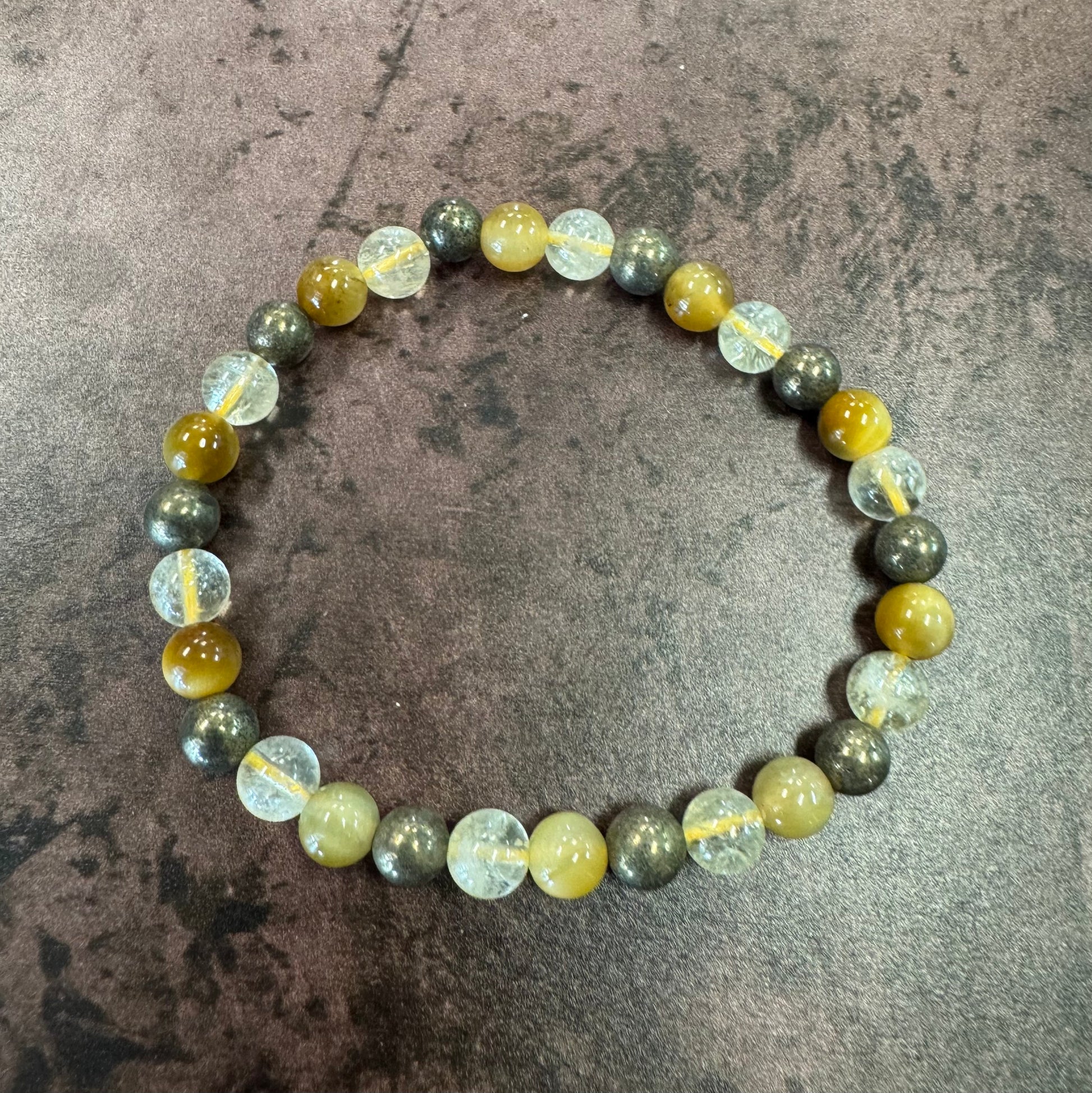 Beaded bracelet with multicolored beads on a textured surface