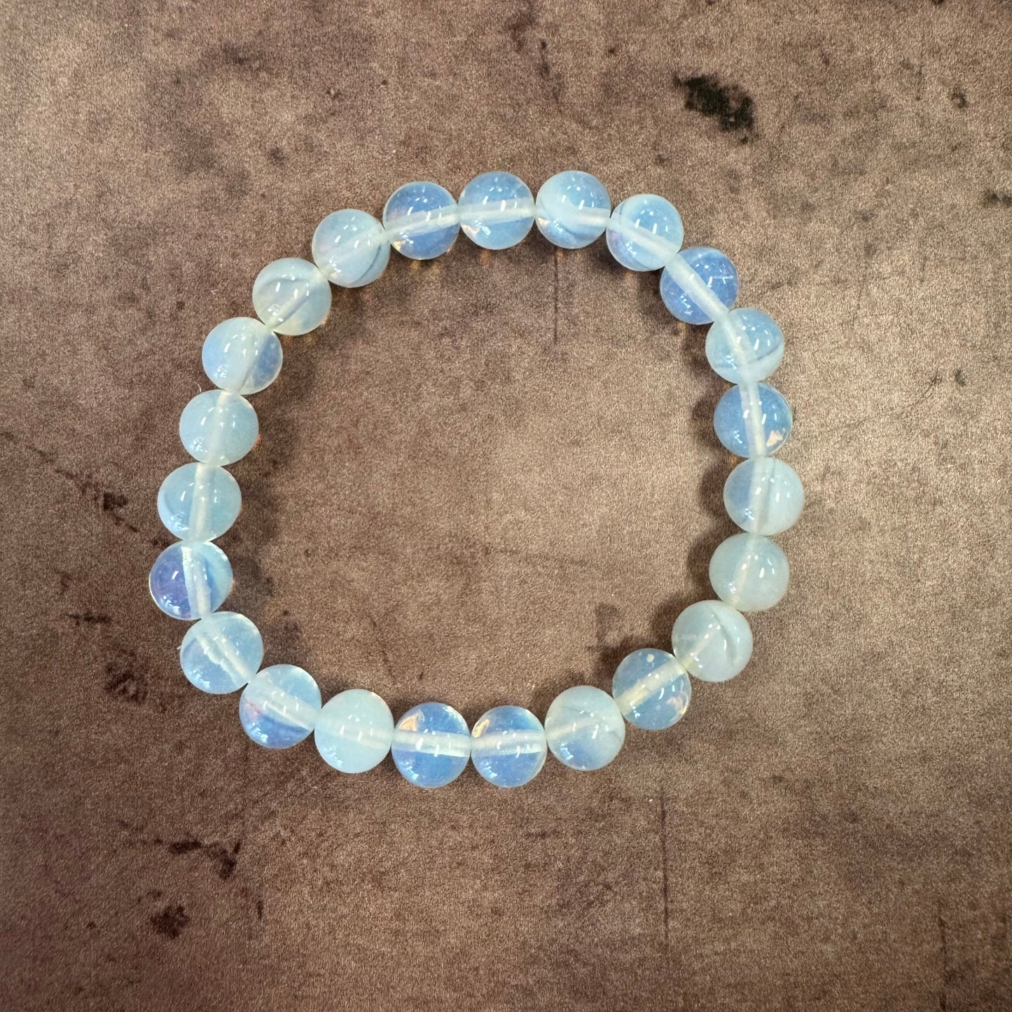 Opalite Beaded bracelet with a textured brown background