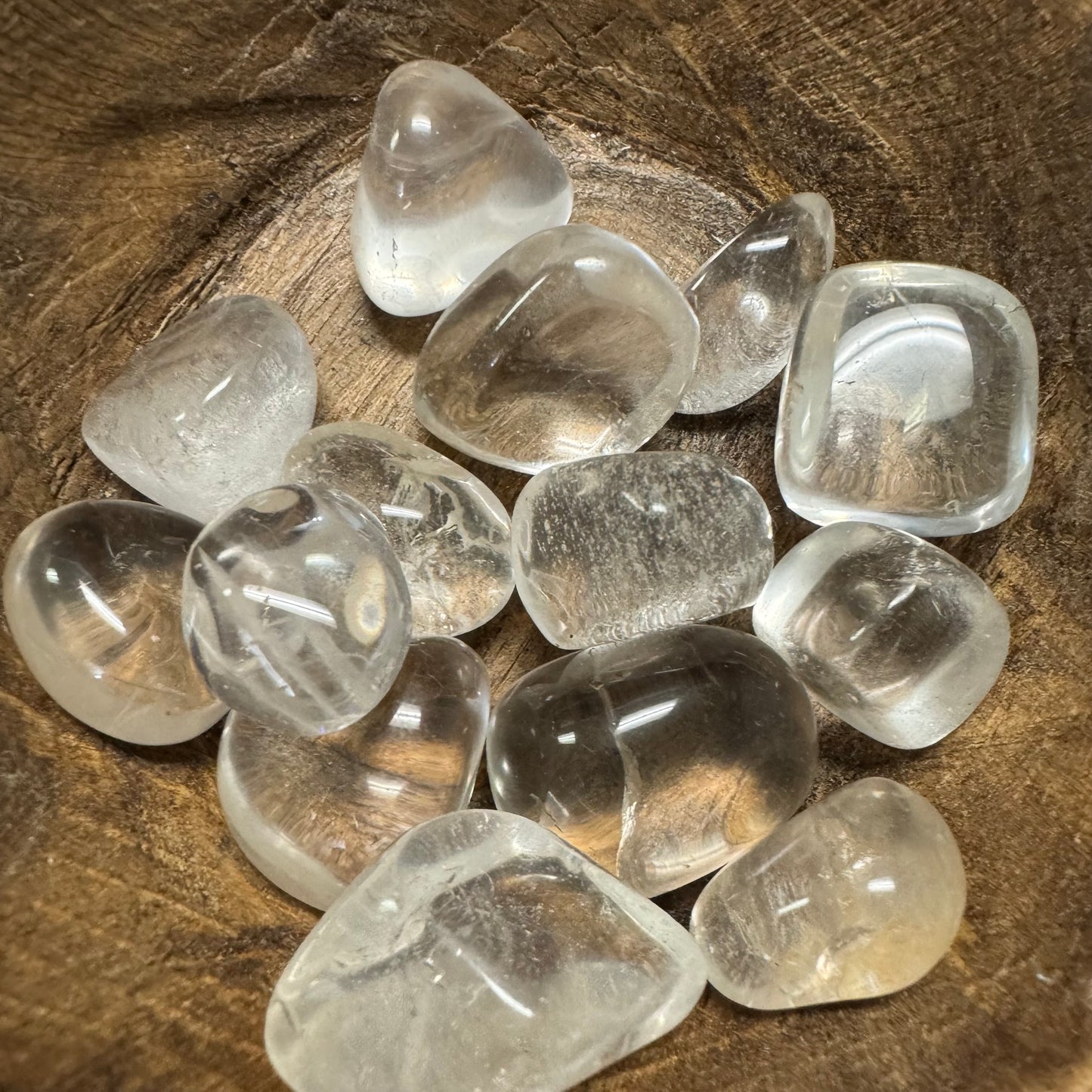 Clear crystal stones on a wooden surface