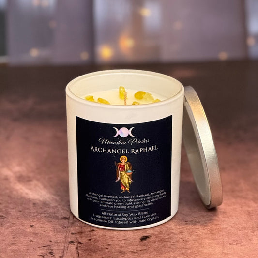 Candle with 'Archangel Raphael' label on a wooden surface