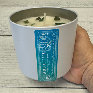 Aquarius candle in hand